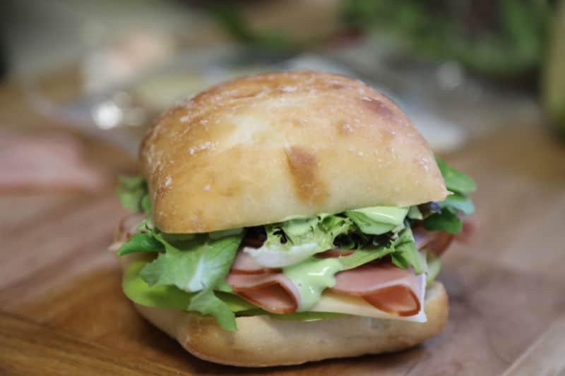 Ham and Swiss Ciabatta Sandwich with Garlic Aioli Recipe on a wooden board