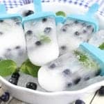 Celebrate Summer with these boozy adult blueberry mojito popsicle recipe! Perfect for parties, barbecues, picnics or any day of the week.