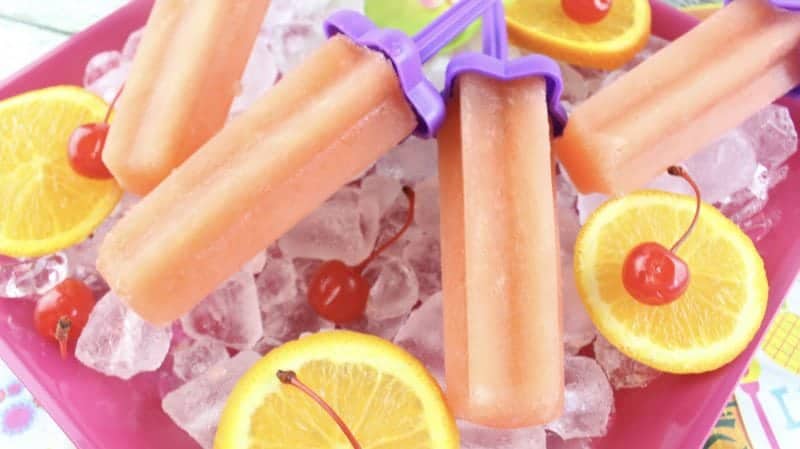 Bahama Mama Recipe for adult ice pops! The perfect cold treat on a hot summer day! Make a larger batch for summer parties, barbecues, tiki party, picnics and more! So easy to make