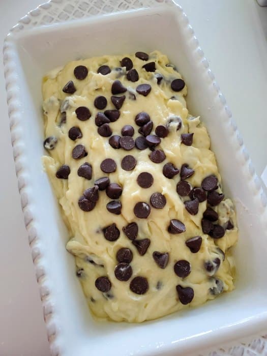 Chocolate chip banana bread batter in a white bread pan