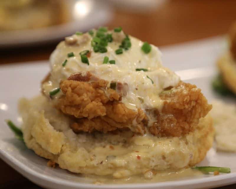fried chicken benedict on a biscuit