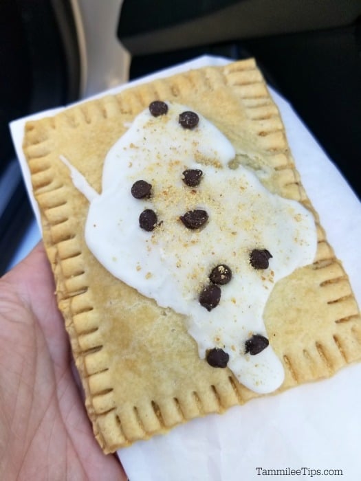 poptart with chocolate chips on it being held in a napkin