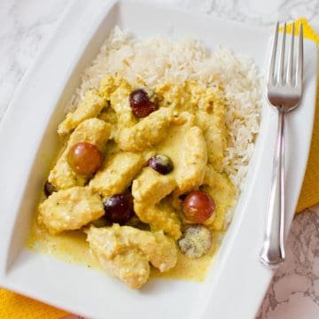 Turkey Curry on a white plate with rice