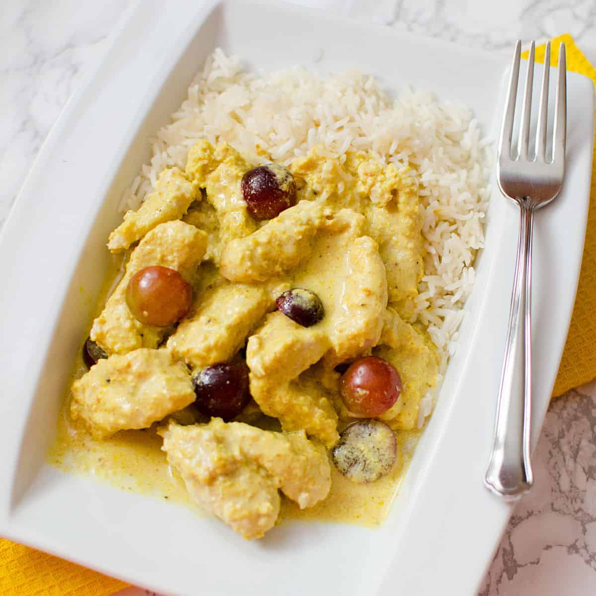 Turkey Curry on a white plate with rice