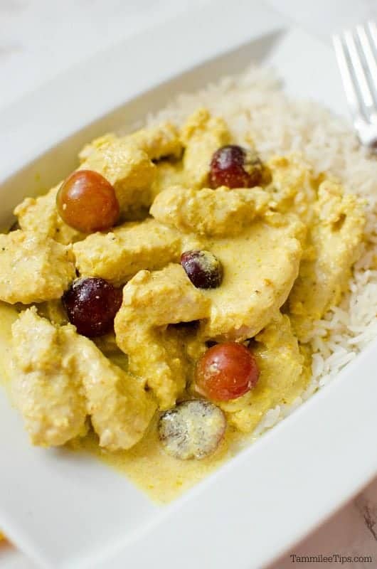 Crockpot Turkey Curry on a white plate with rice