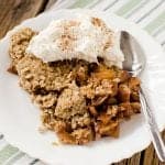 Easy crock pot slow cooker caramel apple crisp that is perfect for family dessert! A great fall comfort food!