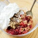 Super easy slow cooker crock pot strawberry crisp recipe with ginger! The perfect summer dessert!