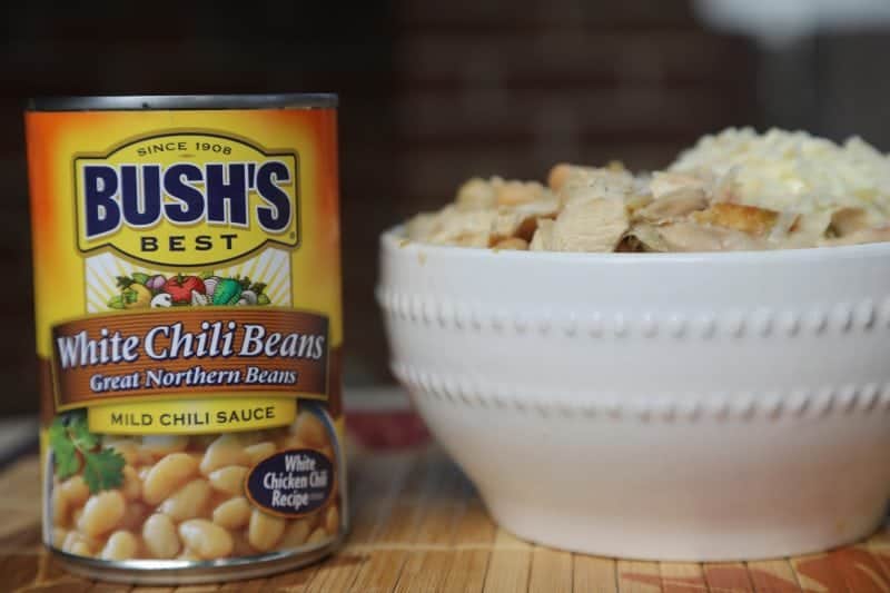 Bush's White Chili Beans can next to a bowl of white chicken chili