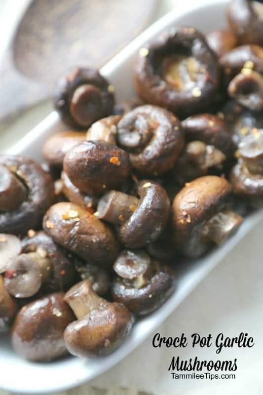 Crockpot Garlic Mushrooms in text written below a white bowl filled with mushrooms