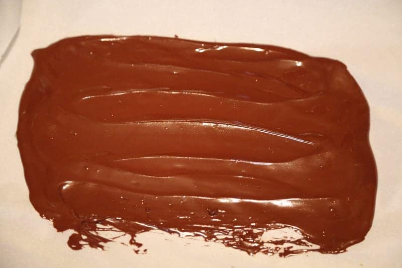 Melted chocolate spread on a parchment paper sheet