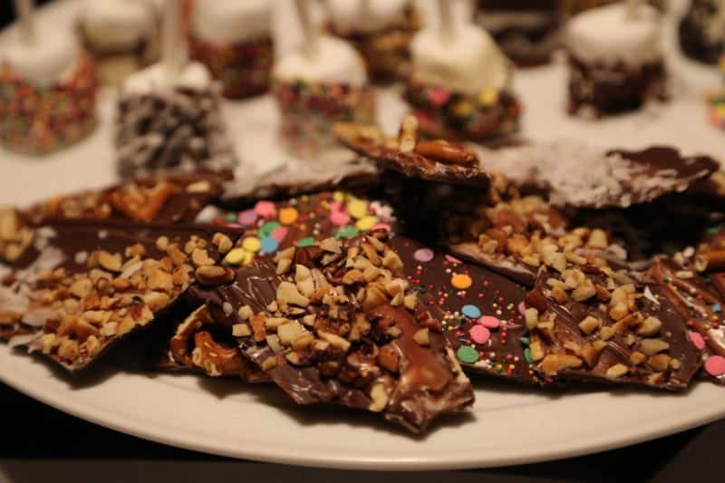 chocolate bark pieces on a white platter