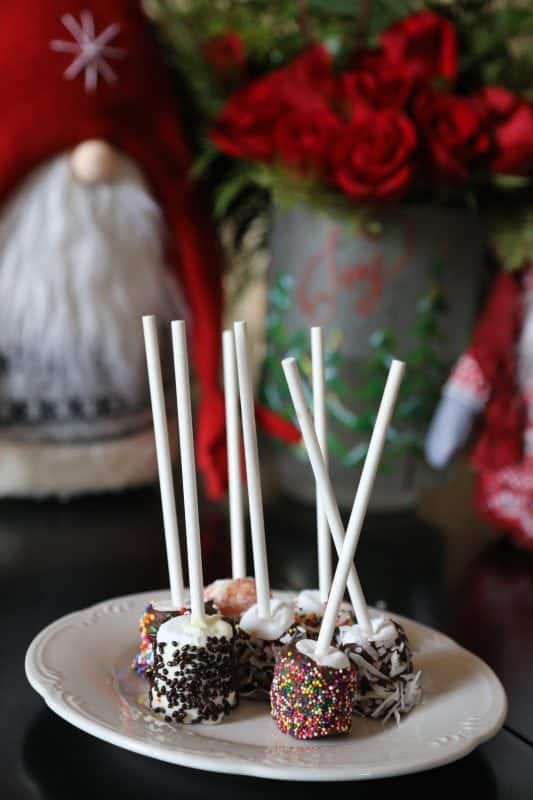 chocolate covered marshmallows on a white plate