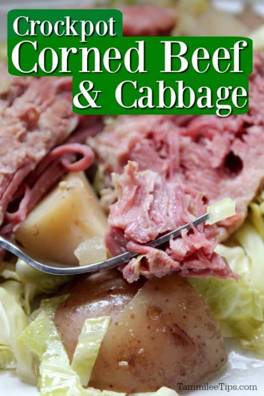 Crockpot Corned Beef and Cabbage text written at the top. Silver fork holding a piece of slow cooker corned beef resting on a sliced potato and cabbage