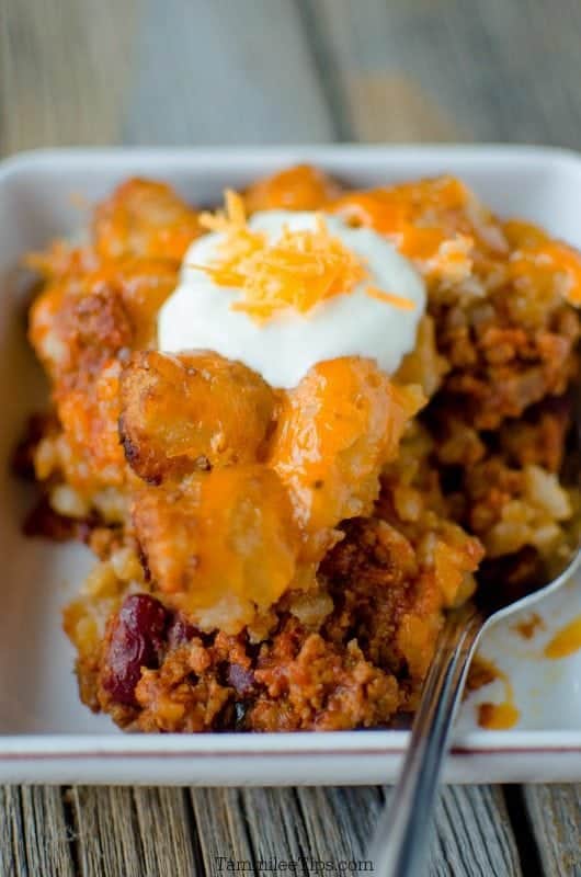 Crockpot Sloppy Joe Tater Tot Casserole on a white plate with a fork