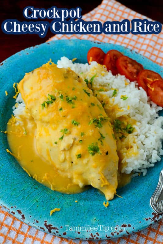 Cheesy Chicken and Rice on a blue plate with sliced tomatoes 