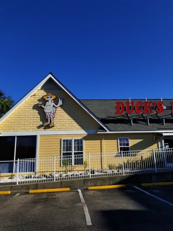 Duck's Diner entrance with a yellow building