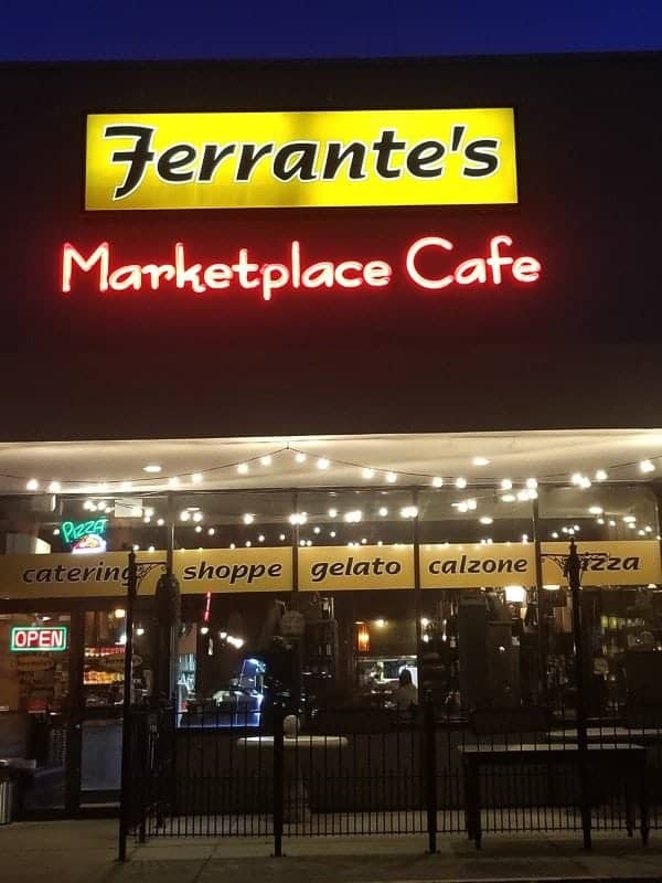 Ferrante's Marketplace Cafe sign over an entrance with signs for gelato, calzone and pizza