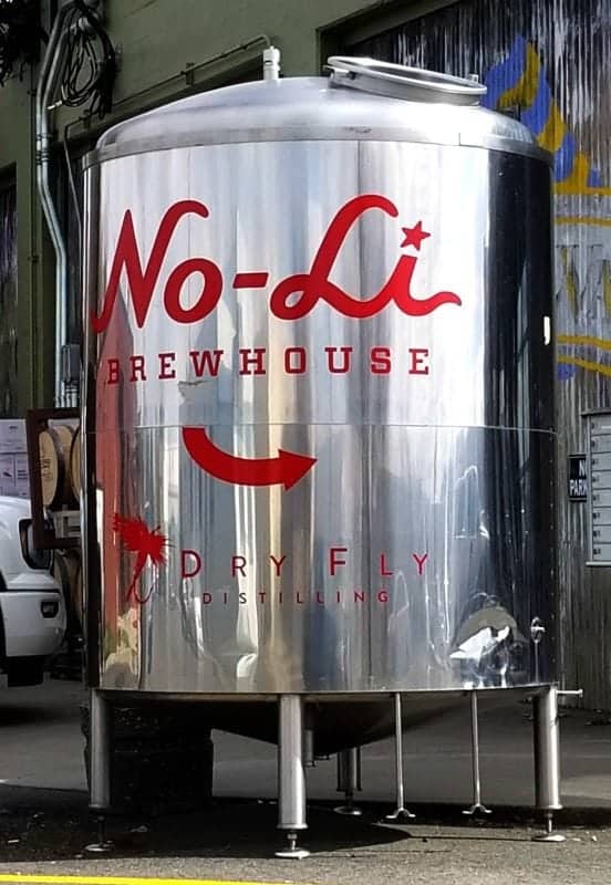 Large silver container with No Li Brewhouse sign