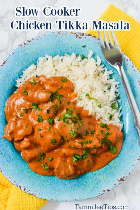 Slow Cooker Chicken Tikka Masala over a blue plate with chicken, white rice, and a fork