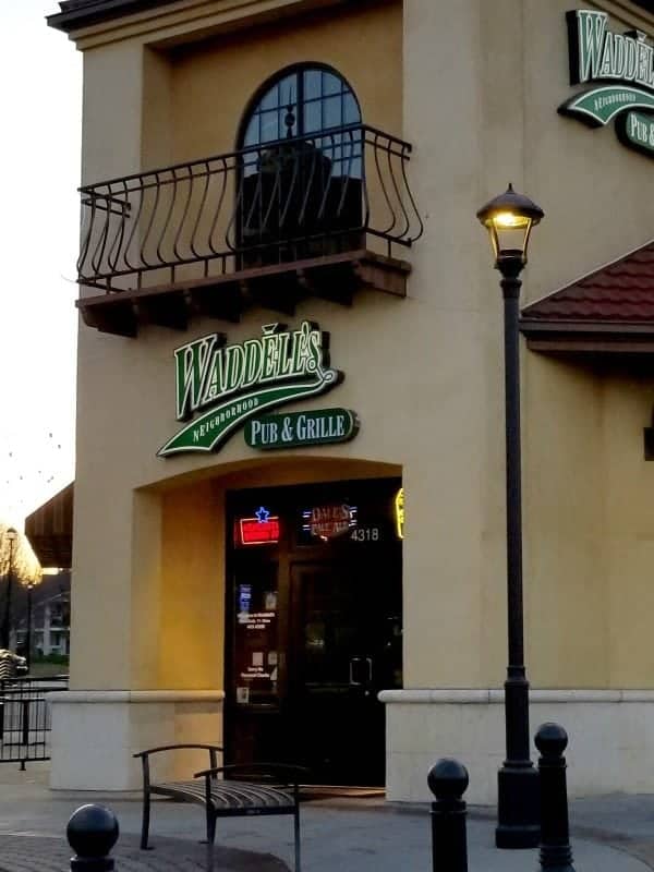 Exterior of Waddell's Neighborhood Pub and Grill with entrance door