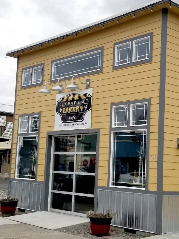 Exterior of Lefevre Street bakery with sign over a large door