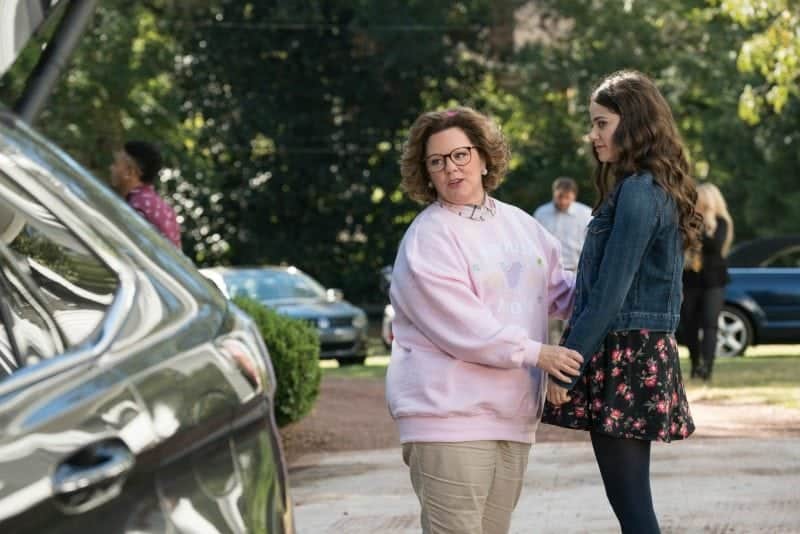 Melissa McCarthy in Life of the Party next to a car