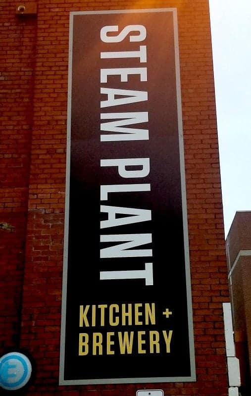 Steam Plant Kitchen and Brewery sign on a brick wall
