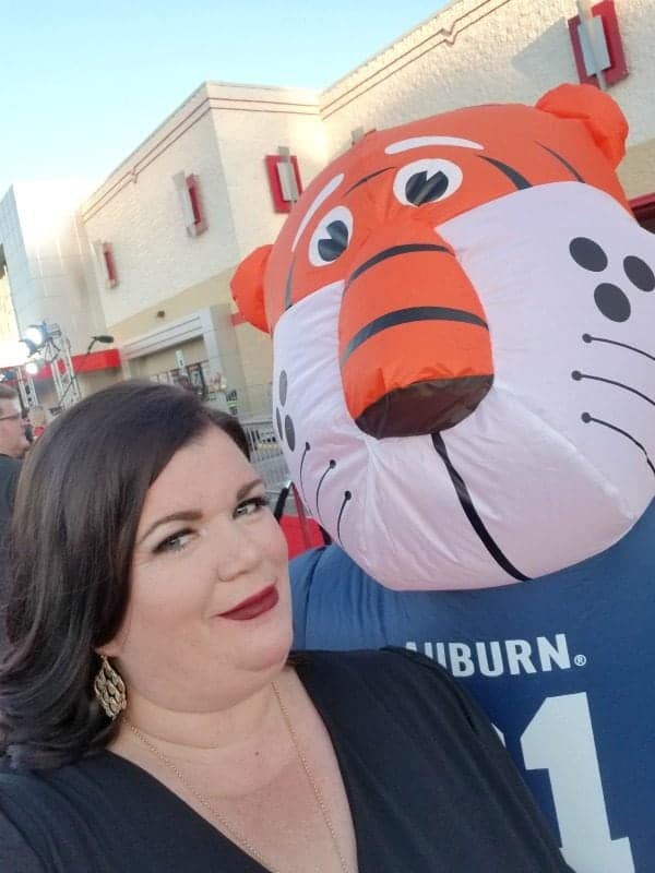 Tammilee next to an Auburn Tigers blow up 