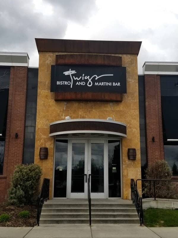 Twigs Bistro and Martini Bar sign over stairs leading up to glass doors