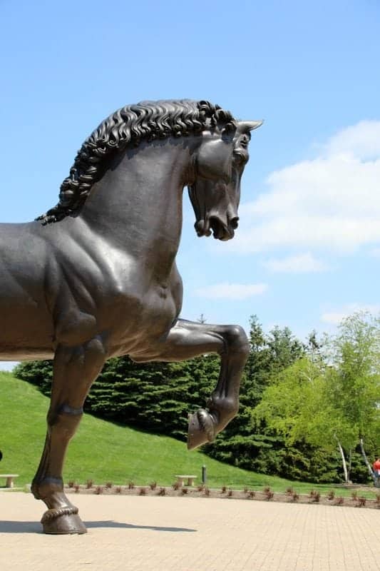 large horse sculpture in the middle of the gardens