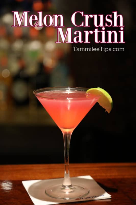 Melon Crush Martini text over a pink martini with a lime wedge on a dark bar