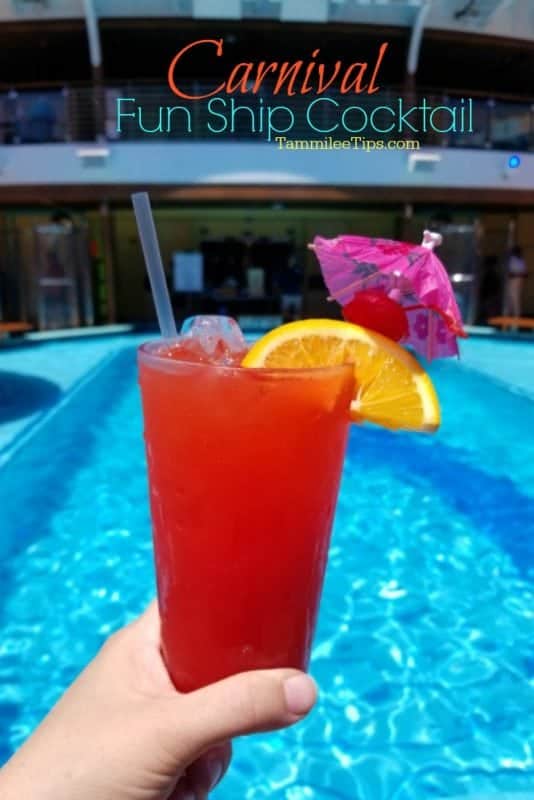 Carnival fun ship text over a red drink next to a pool