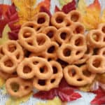 Pumpkin Spice Pretzels piled on fake leaves