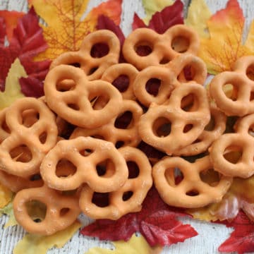 Pumpkin Spice Pretzels piled on fake leaves