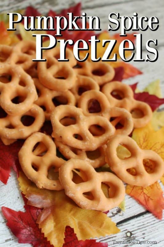 Pumpkin Spice Pretzels text written over a pile of pumpkin spice pretzels on a wood background