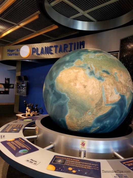 Large globe and space exhibit outside the entrance to the Grand Rapids Public Museum planetarium 