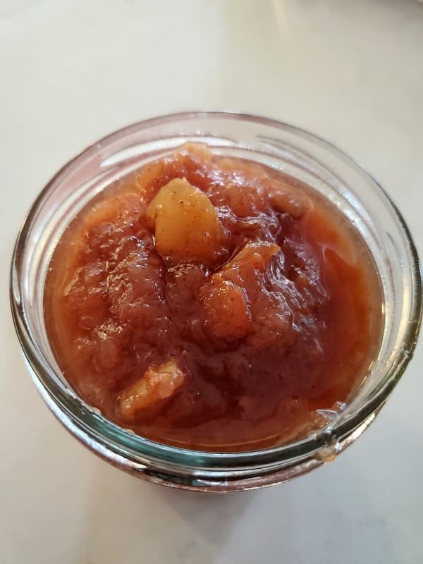 Crockpot pear butter in a glass mason jar 