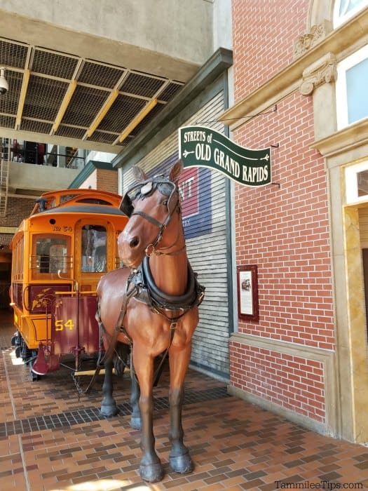 Replica of a horse and streetcar with Streets of Old Grand Rapids Sign in the Grand Rapids Public Museum