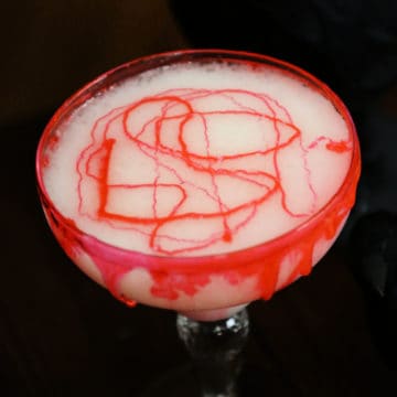 bloody colada cocktail in a margarita glass