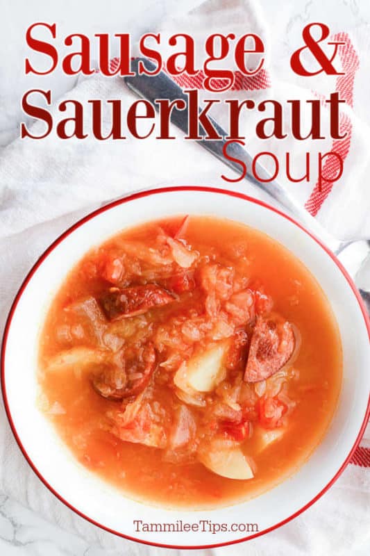 Sausage & Sauerkraut soup over a white bowl with soup on a cloth napkin