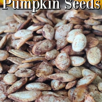 Pumpkin Spice Pumpkin Seeds text over a pile of pumpkin seeds