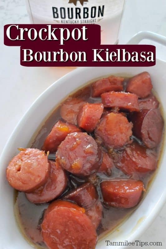 Crockpot Bourbon Glazed Kielbasa over a bottle of bourbon, and a white bowl with slices of kielbasa in a sauce