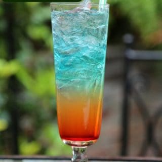 Rainbow Cocktail on an outdoor table