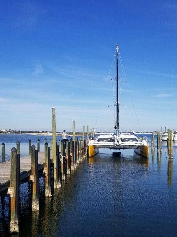 Sail Wild Hearts sailboat at the end of a wooden pier