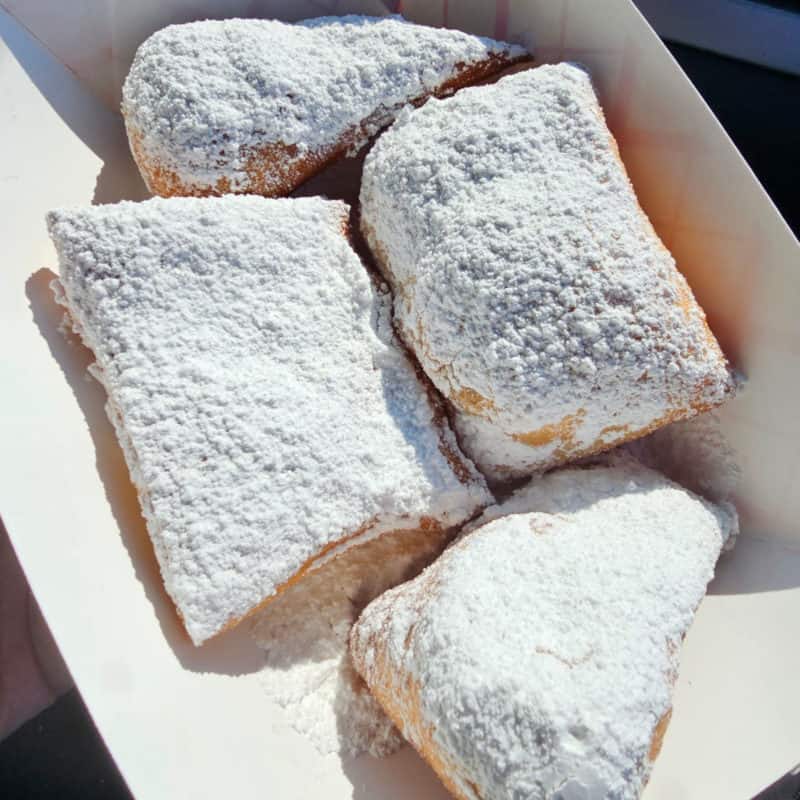 beignets in a paper container