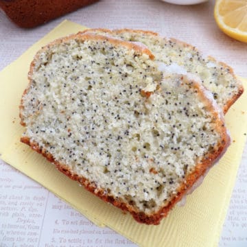 Two slices of lemon poppy seed bread on a yellow napkin