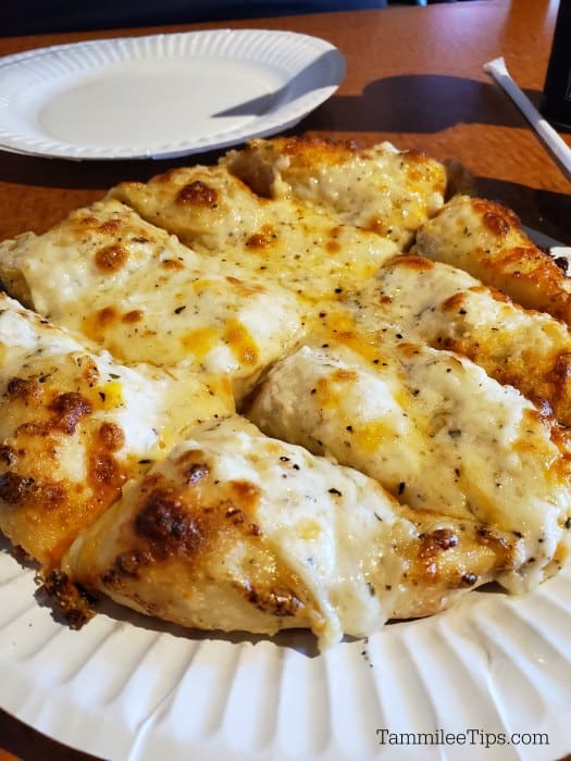 garlic cheese bread on paper plate at me n eds oakhurst