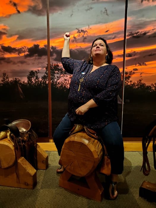 tammilee on a wooden saddle