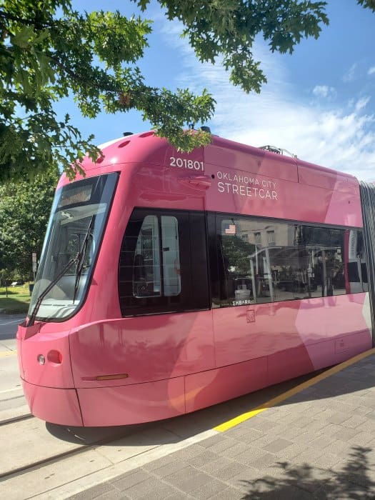 Pink Oklahoma City Street car by trees