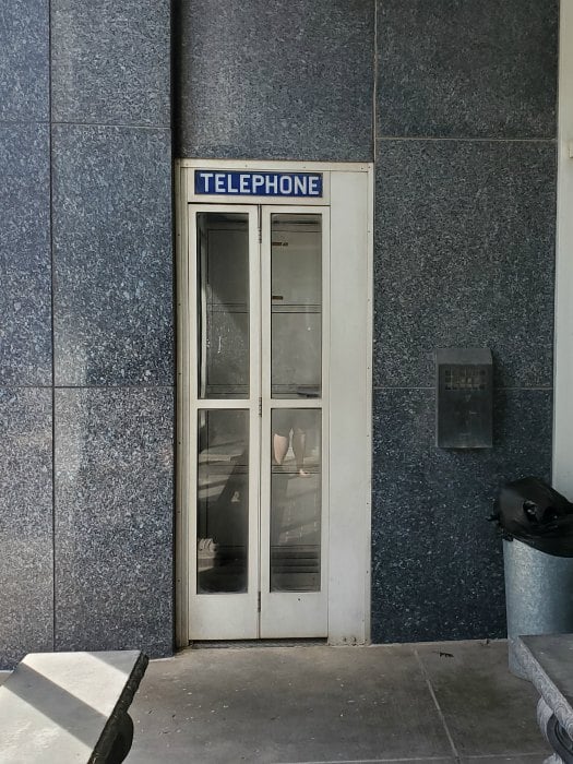 Telephone booth built into a building